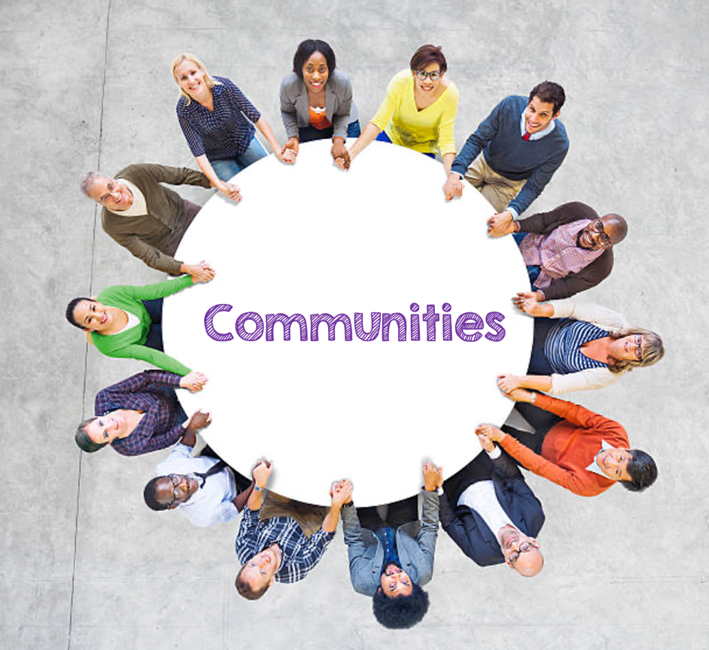 A diverse group of people sitting around a round table, with the text "Communities" on it.